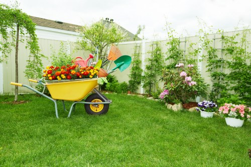 Professional gardener trimming a hedge